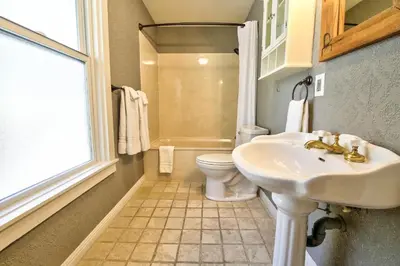 a bathroom with a sink and a toilet at The Groveland Hotel in Groveland