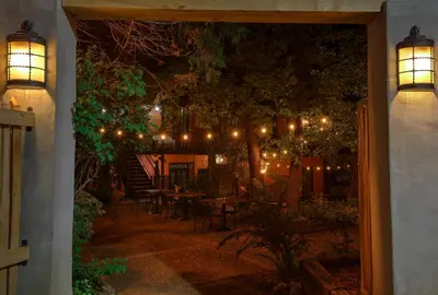a patio at night with lights and a table at The Groveland Hotel in Groveland