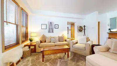 a living room with two couches and a table at Snowcreek 887 Condo in Mammoth Lakes