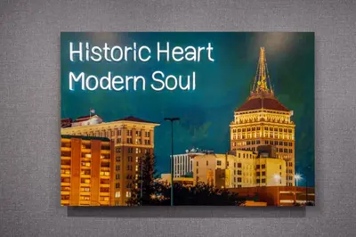 a sign for the historic heart modern south with buildings at Homewood Suites by Hilton Fresno in Fresno