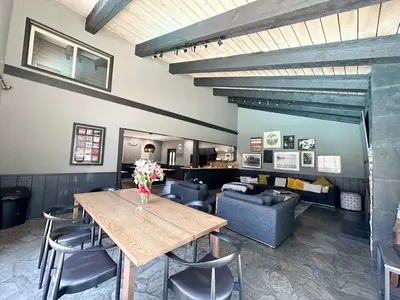 a dining room with a table and a couch at Chamonix Condo 94 Condo in Mammoth Lakes
