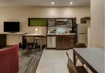 a living room with a kitchen and a dining room at Home2 Suites By Hilton Reno in Reno