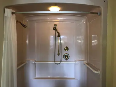 a shower in a bathroom with a shower curtain at Hotel Elevation in South Lake Tahoe