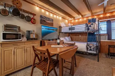 a bedroom with a desk and a bunk bed at Mother Nature's Inn in Tahoe City