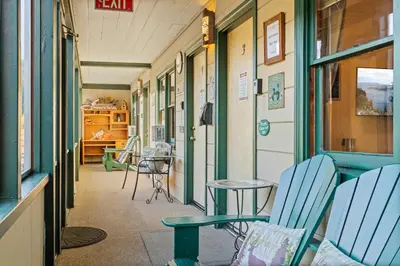 a hallway of a hospital with chairs and tables at Mother Nature's Inn in Tahoe City