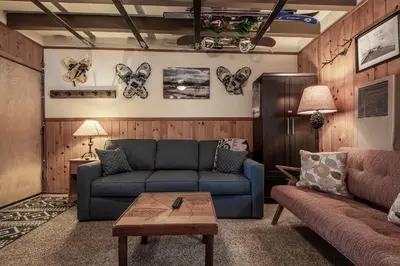 a living room with a couch and a table at Mother Nature's Inn in Tahoe City