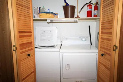 a white washer and dryer in a small kitchen at Mountainback 116 LoftCorner in Mammoth Lakes