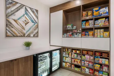 a refrigerator in a grocery store with food at Best Western Plus Sparks-Reno Hotel in Reno