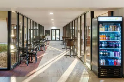 a bar with a drink cooler in a building at Best Western Plus Sparks-Reno Hotel in Reno