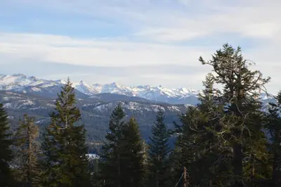 a view from the top of a mountain with snow covered mountains at Montecito Sequoia Lodge in Sequoia National Park