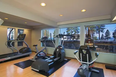 a gym with two treadmills and elliptical machines at Hotel Azure in South Lake Tahoe