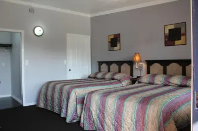 a hotel room with two beds in a room at Garden View Inn in Fresno