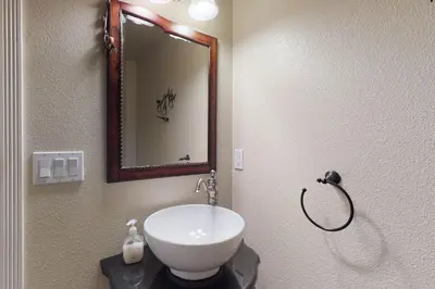 a bathroom with a sink and a mirror on the wall at Pine Mountain Getaway (02-461) in Groveland