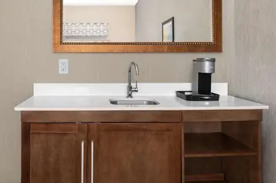 a kitchen with a sink and a coffee maker at Hampton Inn & Suites Sacramento-Auburn Boulevard in Sacramento