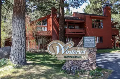 a house with a sign in front of it at Winterset 12 Condo in Mammoth Lakes