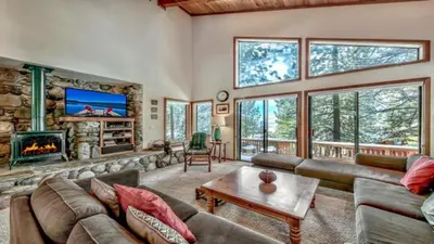 a living room with a couch and a fireplace at Your Roomy Northstar Retreat Awaits in Truckee
