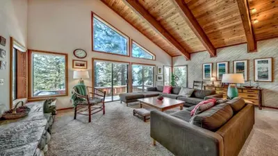 a living room with a couch and a table at Your Roomy Northstar Retreat Awaits in Truckee