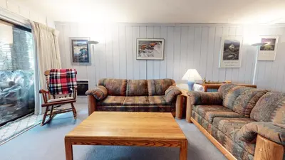 a living room with two couches and a coffee table at Summit Condominium #41 Condo in Mammoth Lakes