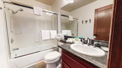 a bathroom with a sink and a toilet and a shower at Helios North #5 Condo in Mammoth Lakes