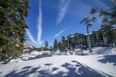 a ski resort in the snow with a ski lift at Helios North #5 Condo in Mammoth Lakes