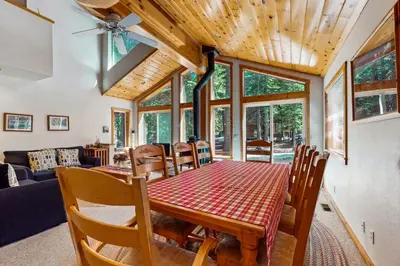 a dining room with a table and chairs at Happy Family Cozy Cabin in Truckee