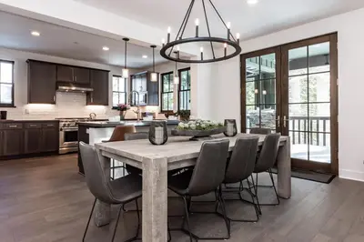 a kitchen and dining room with a table and chairs at Creekhouse 1320 in Mammoth Lakes