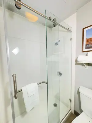 a bathroom with a shower and a toilet at La Quinta Inn by Wyndham Stockton in Stockton