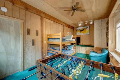 a tub in a room with a swimming pool at Serventi Tahoe Donner Cabin in Truckee