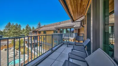 a balcony of a house with chairs on it at Luxury Residence - Gondola Across The Street Condo in South Lake Tahoe