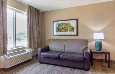 a living room with a couch and a window at Extended Stay America Suites - Sacramento - Roseville in Roseville