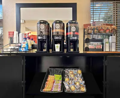 a shelf with drinks and food on it at Extended Stay America Suites - Sacramento - White Rock Rd in Rancho Cordova