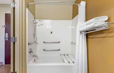 a shower in a bathroom with a white shower curtain at Extended Stay America Suites - Reno - South Meadows in Reno