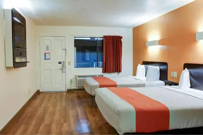 a hotel room with two beds and a window at Motel 6-Bishop, CA in Bishop