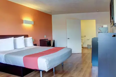 a bedroom with a large bed in a hotel room at Motel 6-Bishop, CA in Bishop