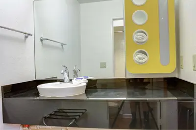 a bathroom with a sink and a toilet at Motel 6-Bishop, CA in Bishop