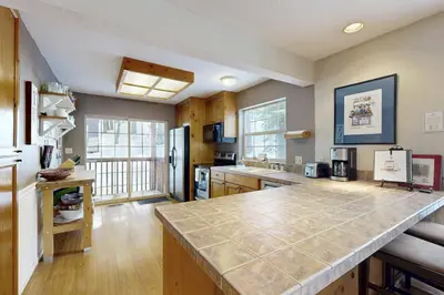 a large kitchen with a large counter top at Welcoming Tahoe-Donner Cabin in Truckee