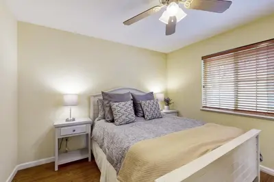 a bedroom with a bed and a ceiling fan at Welcoming Tahoe-Donner Cabin in Truckee