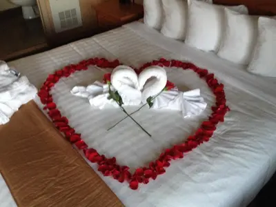 a heart made out of roses on a bed at Pepper Tree Inn Tahoe City in Tahoe City