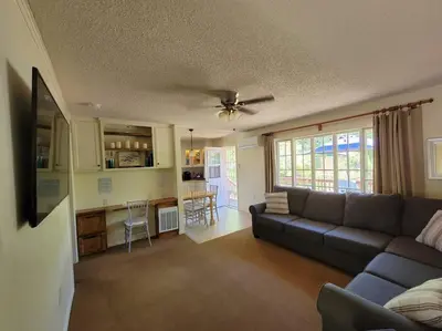 a living room with a couch and a kitchen at Becky's Condo in Mariposa
