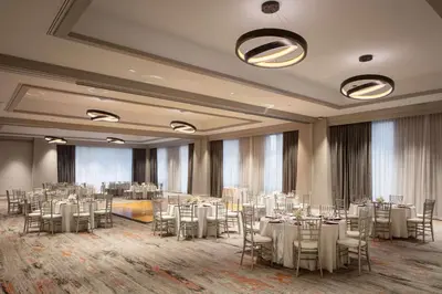 a banquet hall with white tables and chairs at DoubleTree By Hilton Sacramento in Sacramento