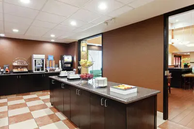 a lobby with a counter with food on it at Hampton Inn & Suites Fresno - Northwest in Herndon
