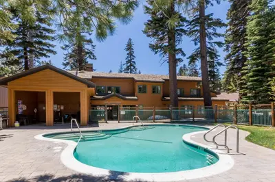 a swimming pool in front of a house at Mountainback 80 in Mammoth Lakes