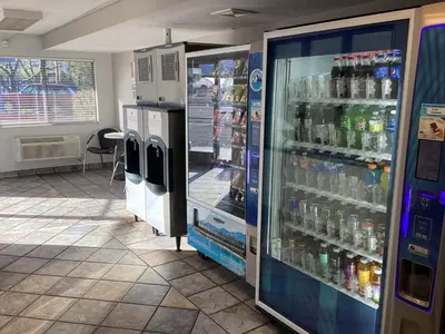 a refrigerator filled with lots of bottles of water at Motel 6-Reno, NV - Livestock Events Center in Reno