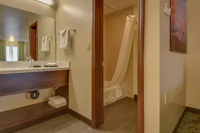 a bathroom with a sink and a shower at Vagabond Inn Bishop in Bishop