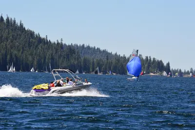 a group of people in a small boat on a lake at Tamarack Dream in Lakeshore