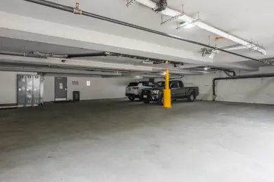 a parking garage with a truck parked in it at Quality Inn near Mammoth Mountain Ski Resort in Mammoth Lakes