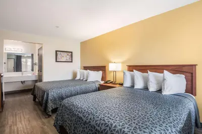 a hotel room with two beds and a window at Econo Lodge Inn & Suites Lodi - Wine Country Area in Lodi