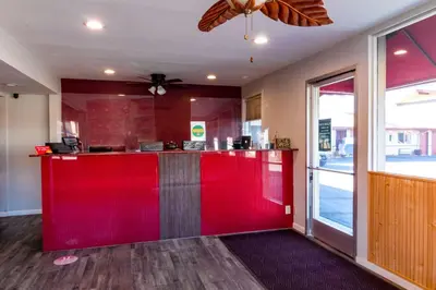 a red bar in a kitchen with a ceiling fan at Quality Inn Bishop near Mammoth in Bishop