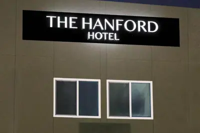 a sign for the hamford hotel on the side of a building at The Hanford Hotel, an Ascend Collection Hotel in Hanford