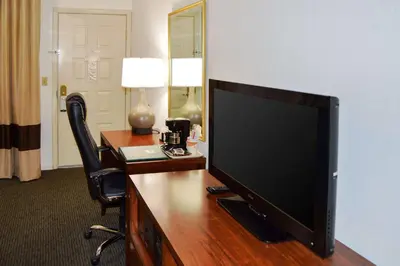 a television sitting on a desk in a hotel room at Quality Inn Yosemite Valley Gateway in Mariposa